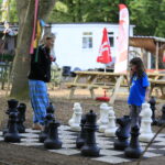 children playing with a chess set