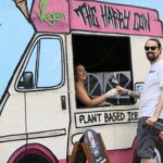 a man buying a vegan ice cream at the vegan kids festival