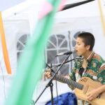 Ruby Derbyshire playing at the vegan kids festival